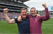 9 July 2022; Westmeath manager Jack Cooney, left, and coach Dessie Dolan celebrate after their side's victory in the Tailteann Cup Final match between Cavan and Westmeath at Croke Park in Dublin. Photo by Seb Daly/Sportsfile