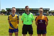 10 July 2022; Referee Gavin Finnegan with Roscommon captain, Laura Fleming, left, and Wexford captain Róisín Murphy before the TG4 All-Ireland Ladies Football Intermediate Championship Semi-Final match between Roscommon and Wexford at Crettyard GAA club, Crettyard, Laois. Photo by Michael P Ryan/Sportsfile
