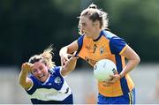 10 July 2022; Chloe Moloney of Clare in action against Clodagh Dunne of Laois during the TG4 All-Ireland Ladies Football Intermediate Championship Semi-Final match between Clare and Laois at St Brigid’s GAA club in Kiltoom, Roscommon. Photo by Brendan Moran/Sportsfile