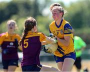 10 July 2022; Laura Fleming of Roscommon in action against Orlagh Kehoe of Wexford during the TG4 All-Ireland Ladies Football Intermediate Championship Semi-Final match between Roscommon and Wexford at Crettyard GAA club, Crettyard, Laois. Photo by Michael P Ryan/Sportsfile