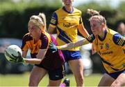 10 July 2022; Kellie Kearney of Wexford in action against Laura Fleming of Roscommon during the TG4 All-Ireland Ladies Football Intermediate Championship Semi-Final match between Roscommon and Wexford at Crettyard GAA club, Crettyard, Laois. Photo by Michael P Ryan/Sportsfile