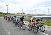 14 July 2022; A general view of the action as the peloton pass Moneypoint during stage three of the Eurocycles Eurobaby Junior Tour 2022 in Clare. Photo by Stephen McMahon/Sportsfile