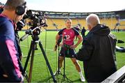 15 July 2022; James Lowe is interviewed by the media after the Ireland rugby captain's run at Sky Stadium in Wellington, New Zealand. Photo by Brendan Moran/Sportsfile