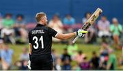 15 July 2022; Martin Guptill of New Zealand celebrates after bringing up his century during the Men's One Day International match between Ireland and New Zealand at Malahide Cricket Club in Dublin. Photo by Seb Daly/Sportsfile