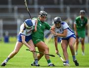 16 July 2022; Ailbhe Larkin of Limerick is tackled by Lorraine Bray, left and Clara Griffin of Waterford during the Glen Dimplex All-Ireland Senior Camogie Quarter Final match between  Waterford and Limerick at Semple Stadium in Thurles, Tipperary. Photo by George Tewkesbury/Sportsfile