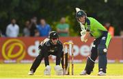 18 July 2022; Harry Tector of Ireland and New Zealand wicket-keeper Dane Cleaver during the Men's T20 International match between Ireland and New Zealand at Stormont in Belfast. Photo by Ramsey Cardy/Sportsfile