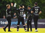 18 July 2022; New Zealand players celebrate a wicket during the Men's T20 International match between Ireland and New Zealand at Stormont in Belfast. Photo by Ramsey Cardy/Sportsfile
