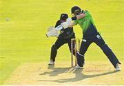 18 July 2022; George Dockrell of Ireland and New Zealand wicket-keeper Dane Cleaver during the Men's T20 International match between Ireland and New Zealand at Stormont in Belfast. Photo by Ramsey Cardy/Sportsfile