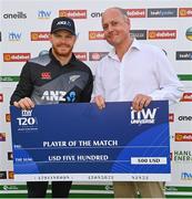 18 July 2022; Glenn Phillips of New Zealand is presented with his Player of the Match cheque by Cricket Ireland CEO Warren Deutrom after the Men's T20 International match between Ireland and New Zealand at Stormont in Belfast. Photo by Ramsey Cardy/Sportsfile
