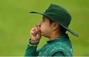 19 July 2022; Nida Dar of Pakistan attempts to keep warm during the Women's T20 International match between Ireland and Pakistan at Bready Cricket Club in Bready, Tyrone. Photo by Ramsey Cardy/Sportsfile