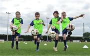 21 July 2022; Quadruplets, from left, Aisling, Lorcan, Caragh and Cormac Britton during the Football For All Summer Soccer School at St Patrick's Boys AFC in Carlow. Photo by Seb Daly/Sportsfile