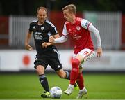 21 July 2022; Chris Forrester of St Patrick's Athletic in action against Matic Maruško of Mura during the UEFA Europa Conference League 2022/23 Second Qualifying Round First Leg match between St Patrick's Athletic and NS Mura at Richmond Park in Dublin. Photo by Stephen McCarthy/Sportsfile