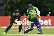 22 July 2022; Paul Stirling of Ireland and New Zealand wicketkeeper Dane Cleaver during the Men's T20 International match between Ireland and New Zealand at Stormont in Belfast. Photo by Ramsey Cardy/Sportsfile