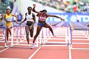 23 July 2022; Nia Ali of USA, right, falls whilst  competing in the women's 100m hurdles heats during day nine of the World Athletics Championships at Hayward Field in Eugene, Oregon, USA. Photo by Sam Barnes/Sportsfile