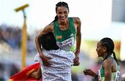 23 July 2022; Letesenbet Gidey of Ethiopia is lifted up by a spectator who ran on to the track after the women's 5000m final during day nine of the World Athletics Championships at Hayward Field in Eugene, Oregon, USA. Photo by Sam Barnes/Sportsfile