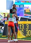 23 July 2022; Gudaf Tsegay of Ethiopa is picked up by a spectator who ran on to the track after winning the women's 5000m final during day nine of the World Athletics Championships at Hayward Field in Eugene, Oregon, USA. Photo by Sam Barnes/Sportsfile