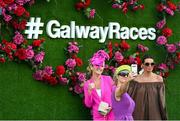 25 July 2022; Racegoers take a selfie prior to racing on day one of the Galway Races Summer Festival at Ballybrit Racecourse in Galway. Photo by Harry Murphy/Sportsfile