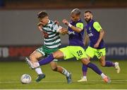 26 July 2022; Adam Wells of Shamrock Rovers is tackled by Pieros Sotiriou of Ludogorets during the UEFA Champions League 2022-23 Second Qualifying Round Second Leg match between Shamrock Rovers and Ludogorets at Tallaght Stadium in Dublin. Photo by Ramsey Cardy/Sportsfile