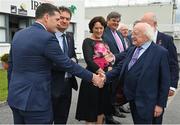 27 July 2022; President of Ireland Michael D Higgins, right, meets Galway Racecourse representatives as he arrives prior to racing on day three of the Galway Races Summer Festival at Ballybrit Racecourse in Galway. Photo by Seb Daly/Sportsfile
