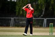 28 July 2022; Fionn Hand of Munster Reds reacts to a delivery during the Cricket Ireland Inter-Provincial Trophy match between Munster Reds and Northern Knights at Pembroke Cricket Club in Dublin. Photo by Sam Barnes/Sportsfile