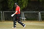 28 July 2022; Gareth Delany of Munster Reds leaves the field after being caught by Tom Mayes of Northern Knights during the Cricket Ireland Inter-Provincial Trophy match between Munster Reds and Northern Knights at Pembroke Cricket Club in Dublin. Photo by Sam Barnes/Sportsfile