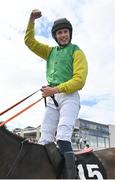 28 July 2022; Jockey Liam McKenna celebrates after riding Tudor City to victory in the Guinness Galway Hurdle Handicap during day four of the Galway Races Summer Festival at Ballybrit Racecourse in Galway. Photo by Seb Daly/Sportsfile