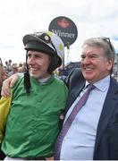 28 July 2022; Jockey Liam McKenna and owner John Breslin celebrate after sending out Tudor City to win the Guinness Galway Hurdle Handicap during day four of the Galway Races Summer Festival at Ballybrit Racecourse in Galway. Photo by Seb Daly/Sportsfile