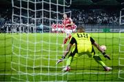 28 July 2022; Ronan Coughlan of St Patrick's Athletic scores a penalty against Mura goalkeeper Matko Obradovic during a penalty shootout during the UEFA Europa Conference League 2022/23 Second Qualifying Round Second Leg match between Mura and St Patrick's Athletic at Mestni Stadion Fazanerija in Murska Sobota, Slovenia. Photo by Vid Ponikvar/Sportsfile