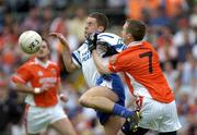 23 May 2004; Kieran Tavey, Monaghan, is tackled by Andrew McCann, Armagh. Bank of Ireland Ulster Senior Football Championship, Monaghan v Armagh, St. Tighernach's Park, Clones, Co. Monaghan. Picture credit; Damien Eagers / SPORTSFILE