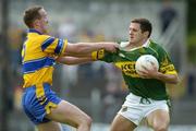 23 May 2004; Eoin Brosnan, Kerry, is tackled by Noel Griffin, Clare. Bank of Ireland Munster Senior Football Championship, Clare v Kerry, Cusack Park, Ennis, Co. Clare. Picture credit; Brendan Moran / SPORTSFILE