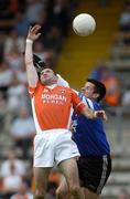 23 May 2004; Steven McDonnell, Armagh in action against Glenn Murphy, Monaghan goalkeeper. Bank of Ireland Ulster Senior Football Championship, Monaghan v Armagh, St. Tighernach's Park, Clones, Co. Monaghan. Picture credit; Damien Eagers / SPORTSFILE