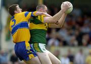 23 May 2004; Micheal Quirke, Kerry, is tackled by Conor Whelan, Clare. Bank of Ireland Munster Senior Football Championship, Clare v Kerry, Cusack Park, Ennis, Co. Clare. Picture credit; Brendan Moran / SPORTSFILE