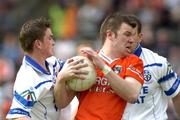 23 May 2004; Ronan Clarke, Armagh, in action against Dessie Mone, Monaghan. Bank of Ireland Ulster Senior Football Championship, Monaghan v Armagh, St. Tighernach's Park, Clones, Co. Monaghan. Picture credit; Damien Eagers / SPORTSFILE