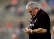 23 May 2004; Armagh manager Joe Kernan takes notes during the game. Bank of Ireland Ulster Senior Football Championship, Monaghan v Armagh, St. Tighernach's Park, Clones, Co. Monaghan. Picture credit; Damien Eagers / SPORTSFILE
