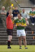 23 May 2004; Standby Referee Haulie Byrne shows a yellow card to Kerry's John Crowley. Bank of Ireland Munster Senior Football Championship, Clare v Kerry, Cusack Park, Ennis, Co. Clare. Picture credit; Brendan Moran / SPORTSFILE