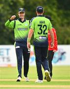15 August 2022; Mark Adair of Ireland celebrates with teammate George Dockrell, left, after dismissing Rahmanullah Gurbaz of Afghanistan during the Men's T20 International match between Ireland and Afghanistan at Stormont in Belfast. Photo by Ramsey Cardy/Sportsfile