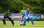 15 August 2022; Rashid Khan of Afghanistan and Ireland wicketkeeper Lorcan Tucker during the Men's T20 International match between Ireland and Afghanistan at Stormont in Belfast. Photo by Ramsey Cardy/Sportsfile