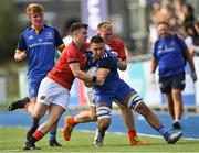 20 August 2022; Aaron O'Brien of Leinster is tackled by Munster players Oscar Davey, left, and Mark Fitzgerald during the U18 Schools Interprovincial Series match between Leinster and Munster at Energia Park in Dublin. Photo by Piaras Ó Mídheach/Sportsfile