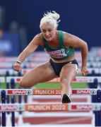 21 August 2022; Sarah Lavin of Ireland on her way to finishing third in Heat 2 of the Women's 100m Hurdles Semi Final during day 11 of the European Championships 2022 at the Olympiastadion in Munich, Germany. Photo by Ben McShane/Sportsfile