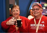 27 August 2022;  Nebraska Cornhuskers supporters Roger and Jennifer Luther from Orleans, Nebraska, inside Buskers Bar during the pre-match tailgate at Temple Bar in Dublin ahead of the The Aer Lingus College Football Classic 2022 match between Northwestern Wildcats and Nebraska Cornhuskers. Photo by Sam Barnes/Sportsfile