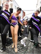 27 August 2022; Amina Rrahmani, aged 6, visiting Dublin from Lyon, France, joins in as the Northwestern Wildcats band and cheerleaders perform outside Fitzsimons bar during the pre-match tailgate at Temple Bar in Dublin ahead of the The Aer Lingus College Football Classic 2022 match between Northwestern Wildcats and Nebraska Cornhuskers. Photo by Sam Barnes/Sportsfile