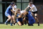 27 August 2022; Kaitlyn Graham of Ulster is tackled by Cara Martinl and Jane Neil of Leinster during the U18 Girls Interprovincial match between Ulster and Leinster at Newforge Country Club in Belfast. Photo by John Dickson/Sportsfile