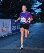 6 September 2022; Siobhán Hoare representing Grant Thornton crosses the line as first place female finisher during the Grant Thornton Corporate 5K Challenge at Kennedy Quay in Cork. Photo by Sam Barnes/Sportsfile