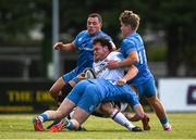 16 September 2022; Lorcan McLaughlin of Ulster is tackled by Hugh Cooney and Matthew Lynch of Leinster during the A Interprovinical match between Leinster A and Ulster A at Templeville Road in Dublin. Photo by Brendan Moran/Sportsfile