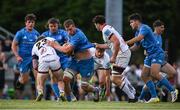 16 September 2022; Cormac Daly of Leinster is tackled by Henry Boyle and Lorcan McLaughlin of Ulster during the A Interprovinical match between Leinster A and Ulster A at Templeville Road in Dublin. Photo by Brendan Moran/Sportsfile