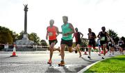 17 September 2022; Runners pass the Phoenix Monument at the Irish Life Dublin Half Marathon on Saturday 17th of September in the Phoenix Park, Dublin. Photo by Sam Barnes/Sportsfile