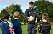 2 October 2022; Leinster Rugby players Rhys Ruddock and Harry Byrne joined Westmanstown RFC minis today for a training session. Pictured is Harry Byrne during an exercise with young Westmanstown RFC players, at Westmanstown RFC in Dublin. Photo by Seb Daly/Sportsfile