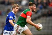 2 October 2022; Andrew Woods of Inniskeen in action against Donal Morgan of Scotstown during the Monaghan County Senior Club Football Championship Semi-Final match between Inniskeen and Scotstown at St Tiernach's Park in Clones, Monaghan. Photo by Philip Fitzpatrick/Sportsfile