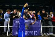 7 October 2022; Phoenix Patterson of Waterford takes pictures with supporters after the SSE Airtricity League First Division match between Waterford and Treaty United at RSC in Waterford. Photo by Michael P Ryan/Sportsfile