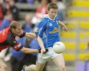 30 May 2004; Gerald Pearson, Cavan, is tackled by Alan Molloy, Down. Bank of Ireland Ulster Senior Football Championship Replay, Cavan v Down, Kingspan Breffni Park, Co. Cavan. Picture credit; Matt Browne / SPORTSFILE